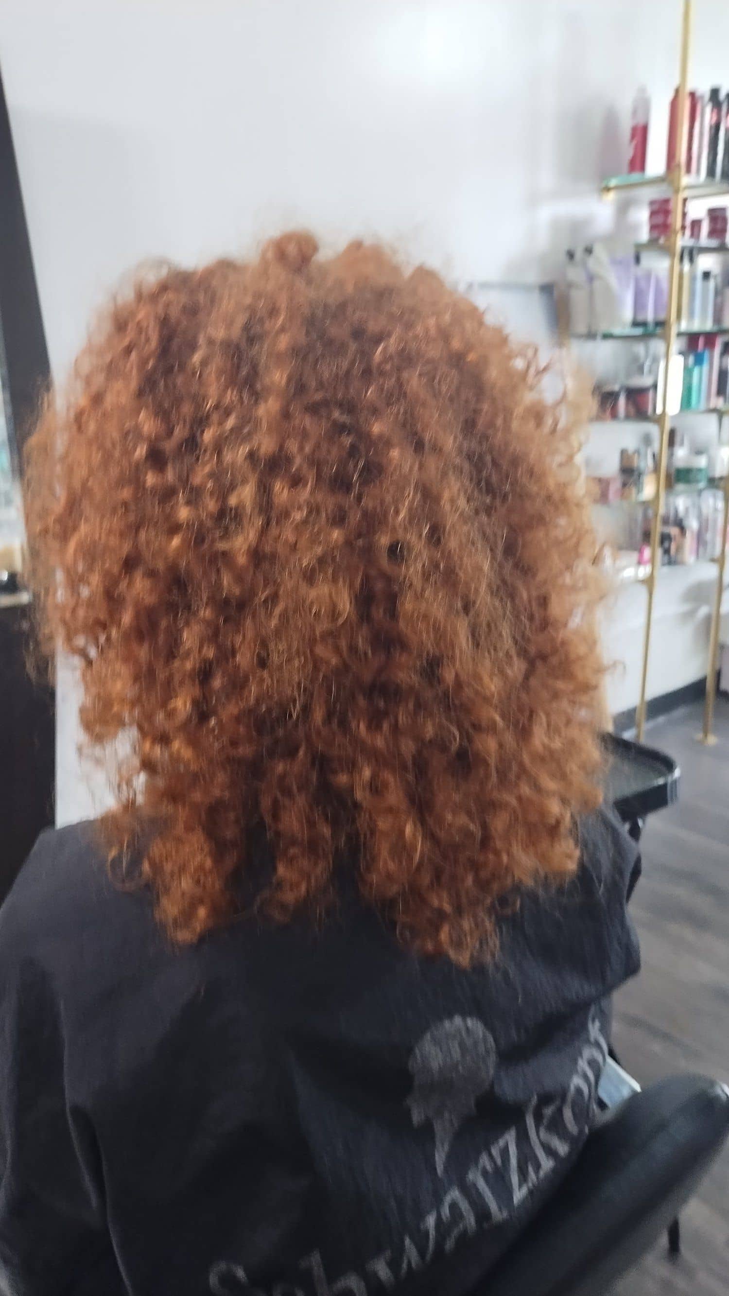 Curly hair styled at Mesmerized Salon